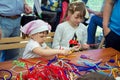 Small girls participating at art and craft outdoor workshop